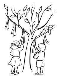 Children hanging wishes on a tree